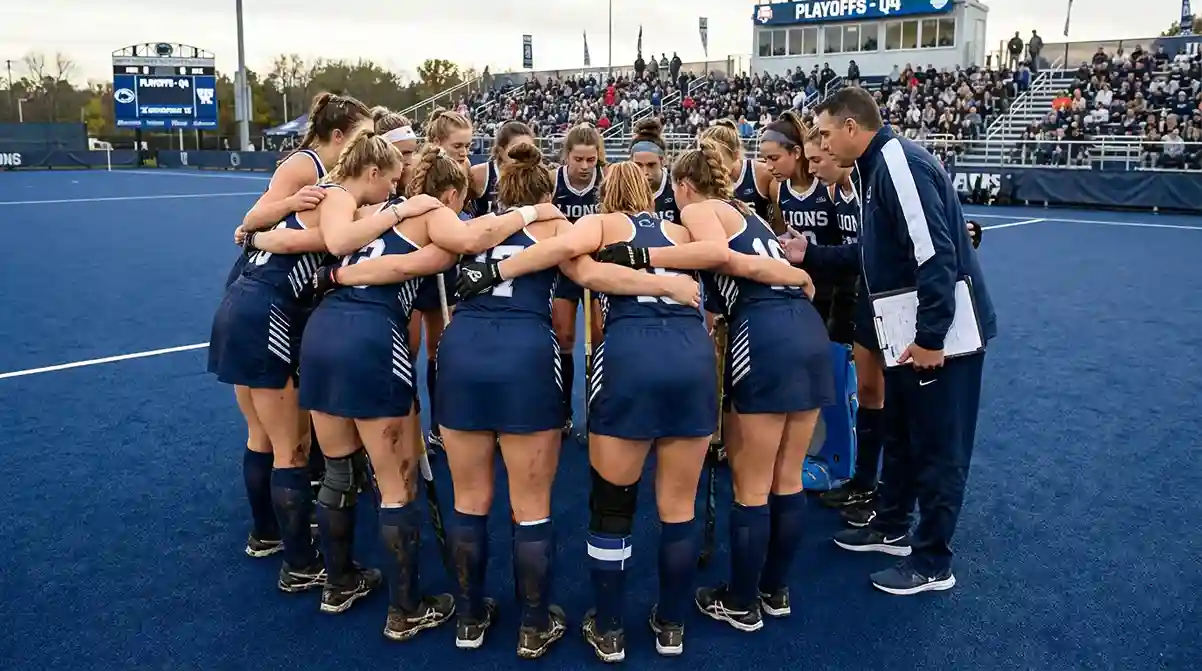 Hockeyteam in een huddle tijdens een tactisch overleg op het veld